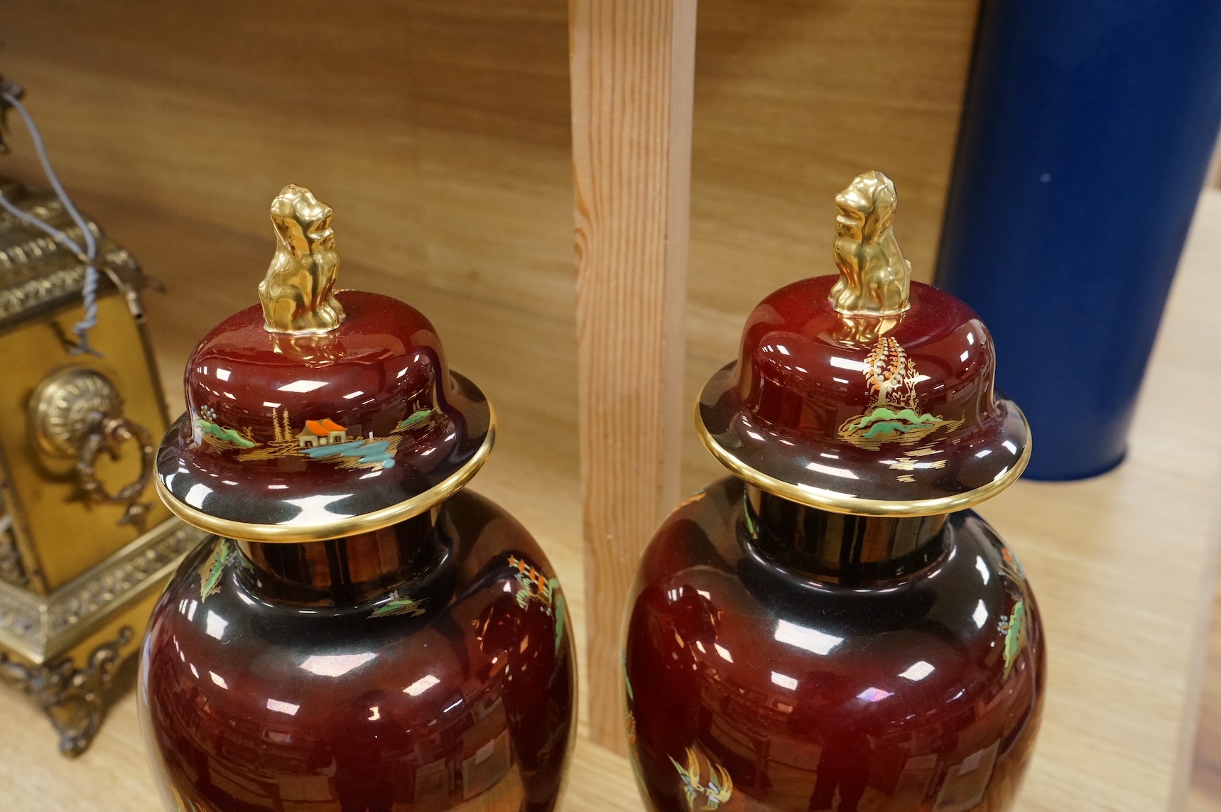A pair of Carlton Ware Rouge Royale lustre vases and covers with chinoiserie decoration, 38cm high